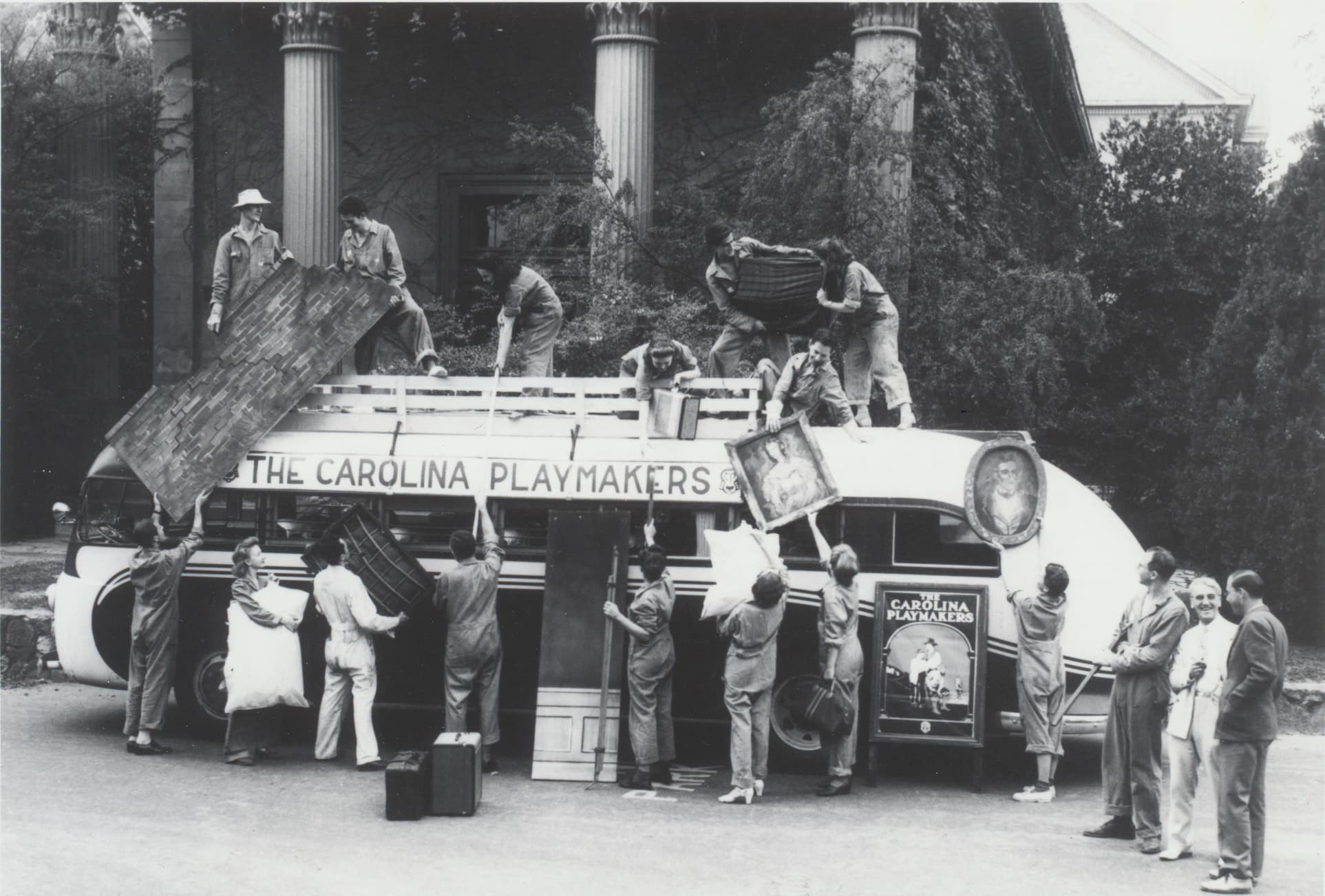 Members of the Carolina Playmakers load a bus with props before leaving on a tour in the fall of 1941. North Carolina Collection, University of North Carolina Library at Chapel Hill