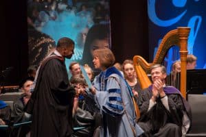 Mike Wiley receives Distinguished Alumnus Award from Chancellor Folt. Photo Courtesy UNC-Chapel Hill College of Arts & Sciences.