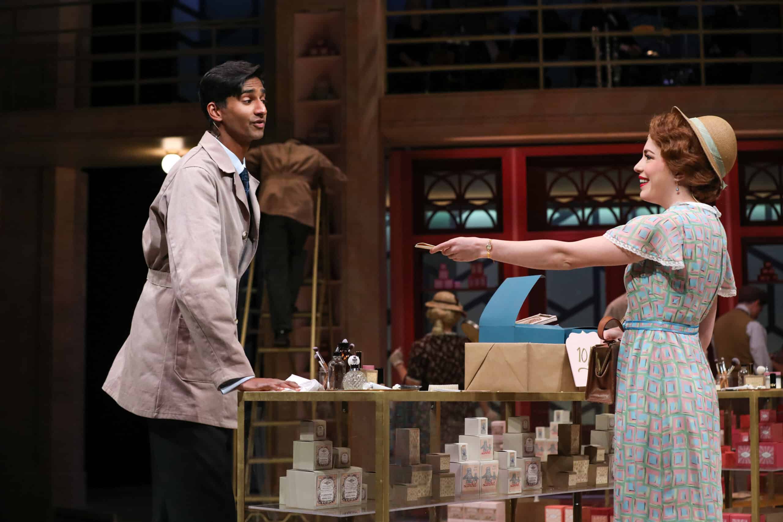 Michael Maliakel as Georg and Jenny Latimer as Amalia in PlayMakers Repertory company's production of SHE LOVE ME. Directed by Kirsten Sanderson. Costume design by Bobbi Owen.