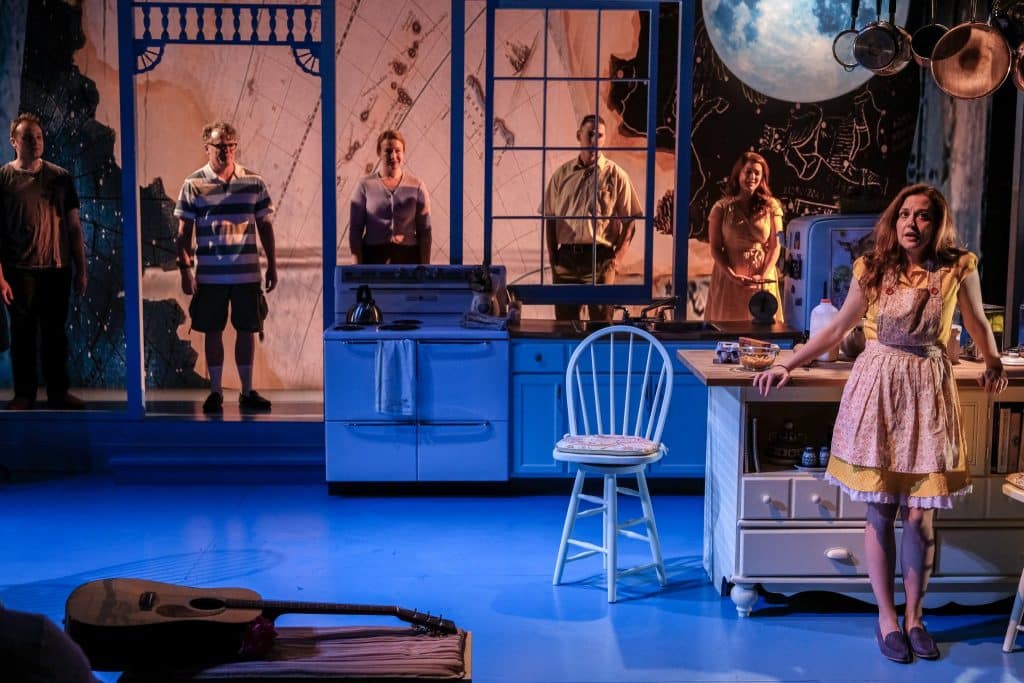 Pictured: Claire Karpen, with Dani Cochrane, and Brian Ogden in the Detroit Public Theatre premiere of BIRTHDAY CANDLES by Noah Haidle. Scenic design by Michael Carnahan, lighting design by Cecilia R Durbin, and costume design byr Shelby Newport.