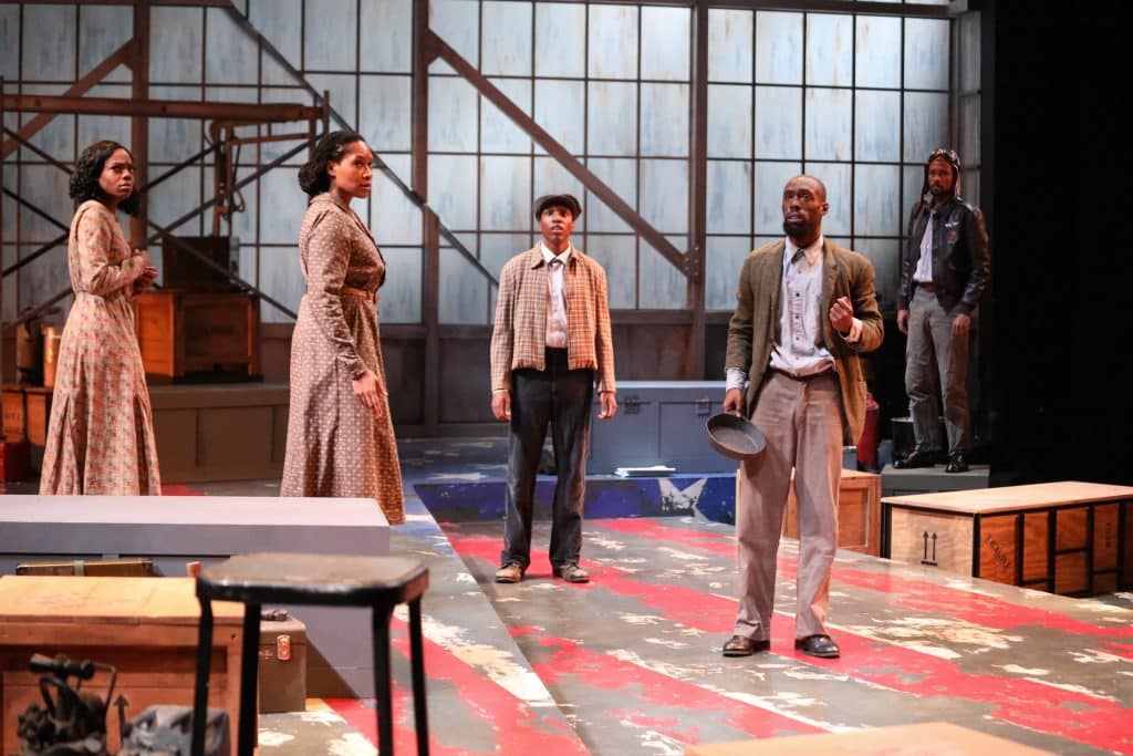 April Mae Davis as Vera Thomas, Tia James as Hannah, Amadio as Buddy, Brandon Herman St. Clair Haynes as Bigger Thomas, and Brandon Pierce as The Black Rat in Nambi E. Kelley’s “Native Son” at PlayMakers Repertory Company. (HuthPhoto)