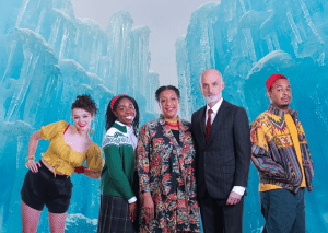 The Antrobus Family smiles in front of a looming ice wall